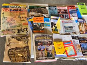 lot 296 image: Collection of Maps and Travel Guides Including AAA Road Atlases and Oslo Travel Guides Assortment of travel-related books and maps featuring various destinations including Wales, Louisiana, and Scandinavia.