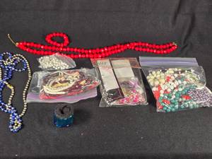 lot 325 image: Assorted Jewelry and Beads Lot including Necklaces, Bracelets, and Loose Beads