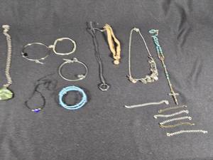 lot 327 image: Assorted Jewelry including Necklaces, Bracelets, and Rosary