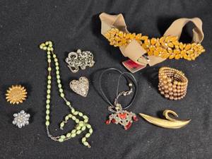 lot 357 image: Lot of Costume Jewelry including Beaded Necklace, Gold Brooch, and Decorative Belt