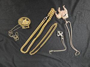 lot 308 image: Necklaces Including Dog and Fleur-de-lis and Jaguar