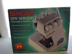 lot 36 image: Mini Singer Serger w Manual & Box