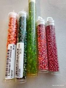 lot 191 image: (5) Full Tubs Glass Seed Beads