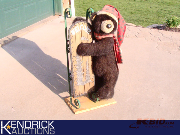 lot 73 image: Bear Welcome Statue Holding a Sled