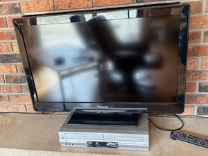 Panasonic VIERA Flat Screen TV w Stand & Toshiba SD-V394 Combo