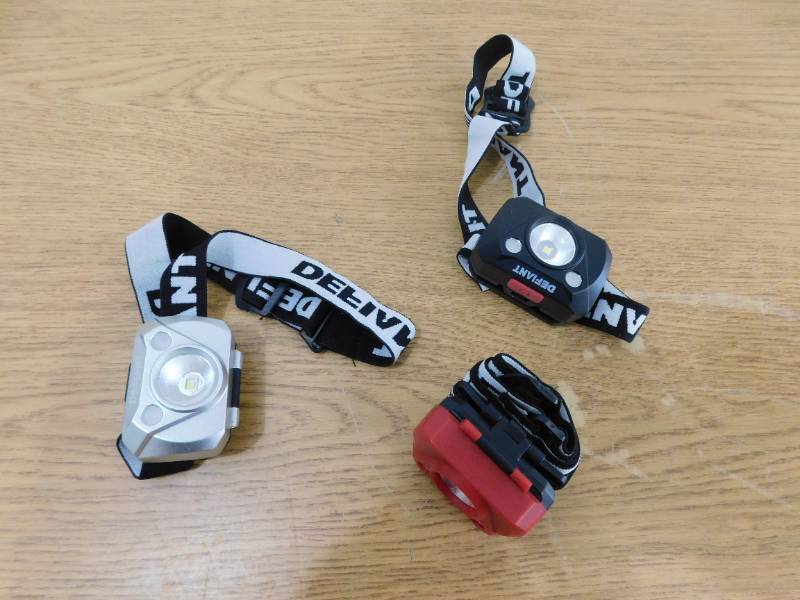 lot 146 image: (3) Defiant Headlamps