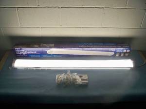 lot 23 image: Feit Electric 10,000 Lumen LED Multi-Directional Shop Light with Motion Detection and 3 Light Modes - appears to be NEW IN OPEN BOX