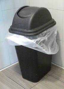 lot 45 image: 4 garbage cans and a wet floor sign