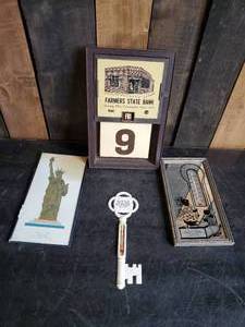 lot 12 image: Mixed Vintage Lot, Farmers State Bank Calander, Statue of Liberty Display, Key Thermometer, and Beardsley Farmers elevator thermometer
