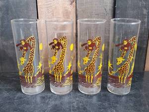 lot 83 image: Vintage Mid Modern Drinking glasses with Monkey and Giraffe Design great for the kiddos