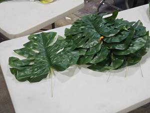 lot 588 image: Lot of (10) Faux Monstera Tropical Leaf Dcor