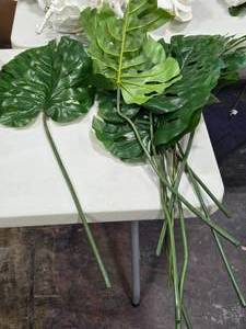 lot 568 image: Lot of (9) 40 Faux Monstera Tropical Leaf Dcor
