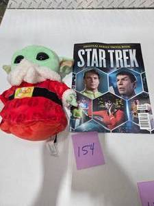 lot 154 image: Grogu Baby Yoda Plush Holiday Outfit  Star Trek Original Series Trivia Book
