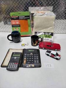 lot 193 image: Star Wars Mug Elvis Mug Diecast Cars Calculators Rug Mats Sandpaper Lot