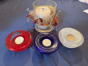 Three Kosta Boda Red, White and Blue Candles and Larger Decorative Candle