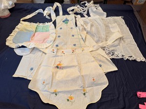 Three Vintage Handmade Adult Aprons and a Childs Niagara Falls Apron