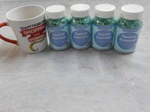lot 379 image: 4 Bottles Taurine Gummies and Cup...