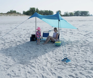 lot 142 image: Ozark Trail 6.8 ft. x 6.7 ft. Blue Quick-Set Portable Sun Shade Beach Tent
