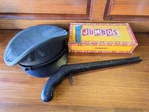 lot 33 image: Military Hat, Snap Play Gun, and Jumbos Cigar Box