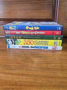 lot 54 image: Shark Tale, Grinch, Hobbit, 350 Classic Cartoons, The Pacifier