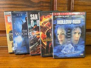 lot 58 image: 5 DVDs Hollow Man, Hunger Games, San Andreas Quake, The Last Witch Hunter, Bad Boys and Bad Boys 2