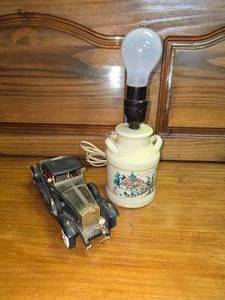 lot 95 image: Lamp and Old Car