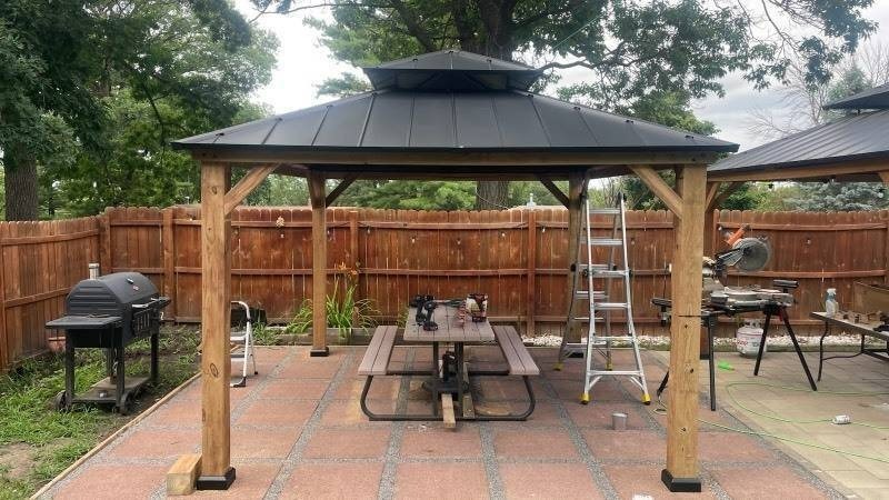 lot 1 image: New Complete Gazebo -13 ft. x 11 ft. Black Wooden Hardtop Gazebo Top with Galvanized Steel Double Roof with Hardwood Black Ash Lumber