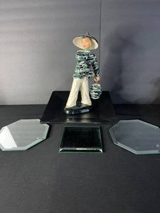 lot 88 image: Porcelain Figurine of Woman in Green Swirl Blouse with Hat & Bag