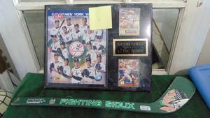 lot 45 image: New York Yankees Plaque and Small Sioux Hockey Stick