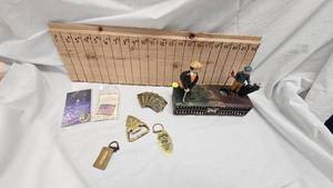lot 22 image: Golfing Animated Coin Bank-Cast Iron with Belt Buckles and Misc Items