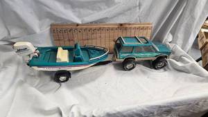 lot 47 image: Ford Ocean Runner with Boat and Trailer(motor was working before wires disconnected)
