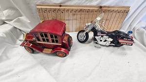 lot 61 image: Vintage Grand-pa Car Tin Lith, and HD  Buddy L Patrol Toy