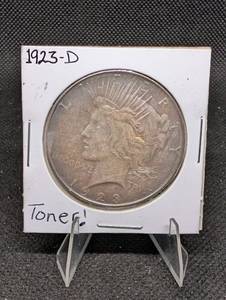 lot 39 image: Toned 1923-D Peace Dollar