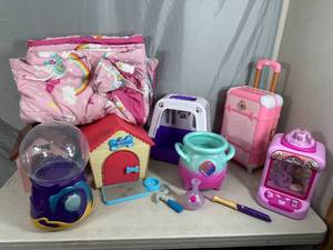 lot 47 image: Large Lot of Toys, Dog Houses, Claw Game, Suitcase, Blanket, and More