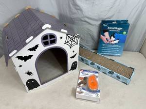 lot 56 image: Assorted Pet Supplies, Groom Mister, Grooming Wrap, House, Scratcher