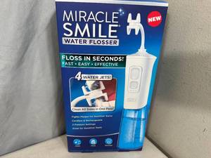 lot 222 image: New Miracle Smile Water Flosser