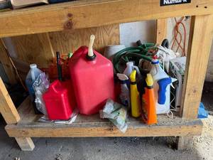 lot 38 image: Assorted Automotive Fluids & Cleaning Supplies - Red Jugs, Washer Fluid, Sprays - quantities unverified