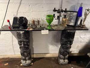 lot 121 image: Table - Black Tiki Totem Leg Table, 60 x 37 Inches - table only