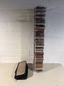 lot 122 image: CDs Collection - Eminem, Blink-182, Green Day & More - most sleeves missing CDs that are in Rack