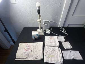 lot 130 image: White Ceramic Table Lamp w Timer & VTG Embroidered TowelsLinens
