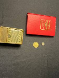 lot 131 image: Equitable Building & Loan Brass Lock Box 7518 with 1979 A Guide Book of United States Coins w Dutch Coin & Oregon Medallion