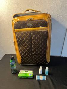 lot 134 image: American Flyer Suitcase - Vintage Yellow Pattern with Front Pocket w Travel Accessories quantities unverified