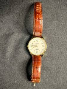 lot 145 image: Timex Perpetual Calendar Indiglo Watch - Gold Tone Case, Brown Leather Strap, WR 100M