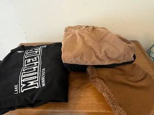 lot 177 image: Assorted Graphic Tees & Hoodies - Mille Lacs Lake MN Hoodie, Sturgis Rally Tee in Laundry Basket