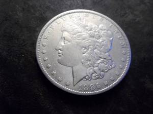 lot 17 image: 1886 O Morgan Silver Dollar