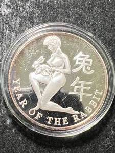 lot 34 image: 1 TROY OZ .999 FINE SILVER YEAR OF THE RABBIT ROUND IN AIRTITE