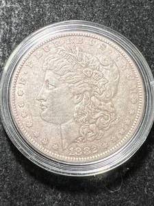 lot 52 image: 1882-O US MORGAN SILVER DOLLAR IN AIRTITE