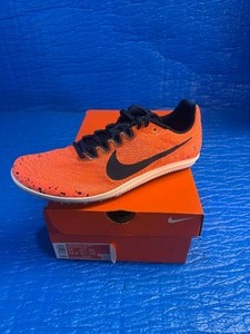 lot 95 image: Size 1112.5 Nike Zoom Rival D 10 track and field spikes in the Bright Mango colorway.