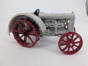lot 34 image: Fordson Tractor Toy - Vintage Detroit USA Plastic w Red Spoked Wheels