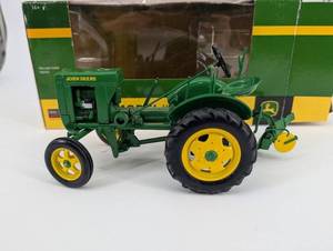 lot 59 image: John Deere Model L Tractor - 116 Scale Die-Cast with Plow